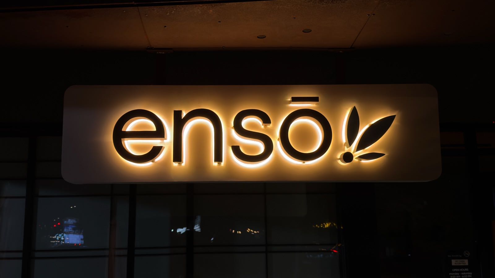 Ensō sign with halo-lit letters glowing at night, made by M3 Graphics