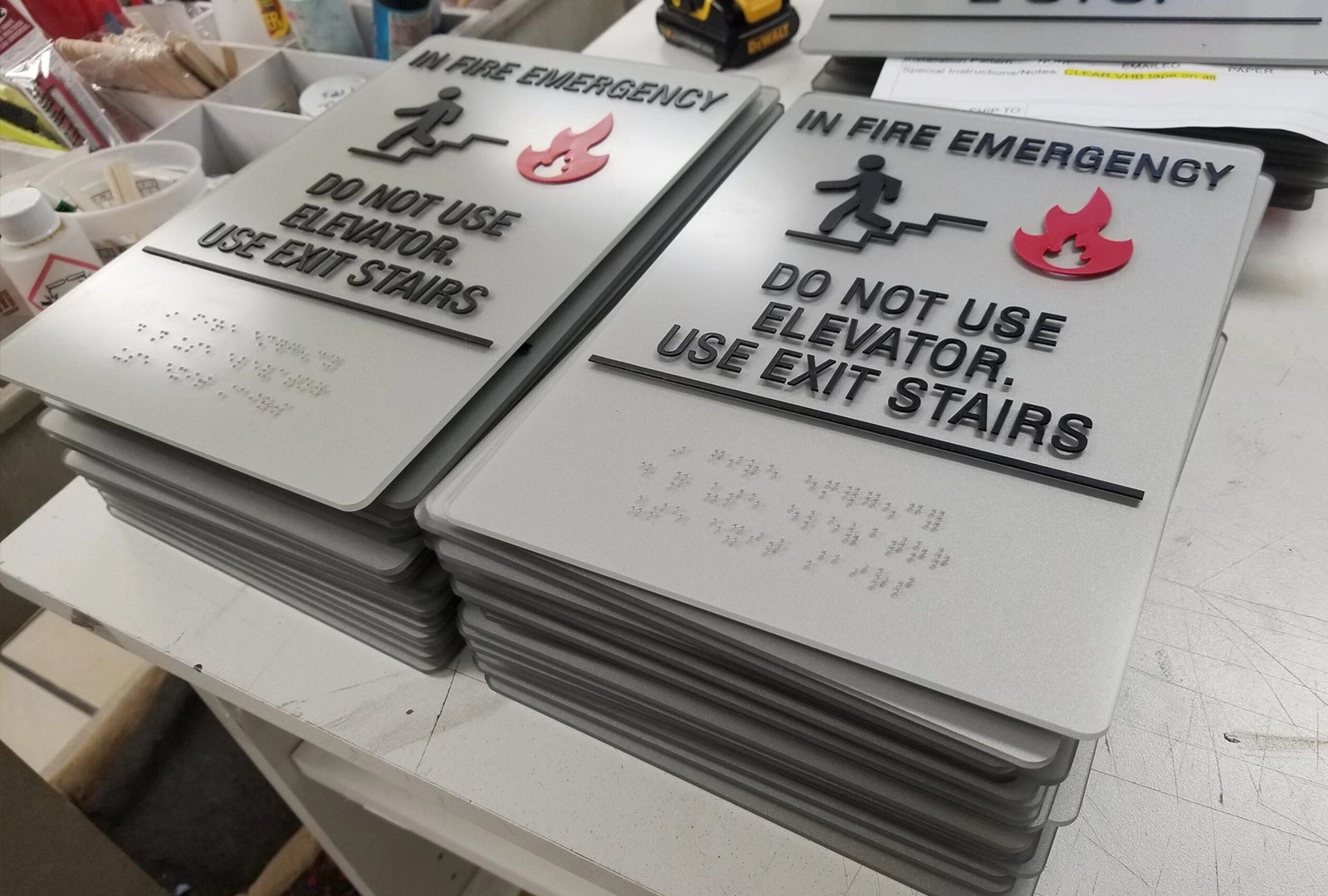 Stack of ADA-compliant braille signs