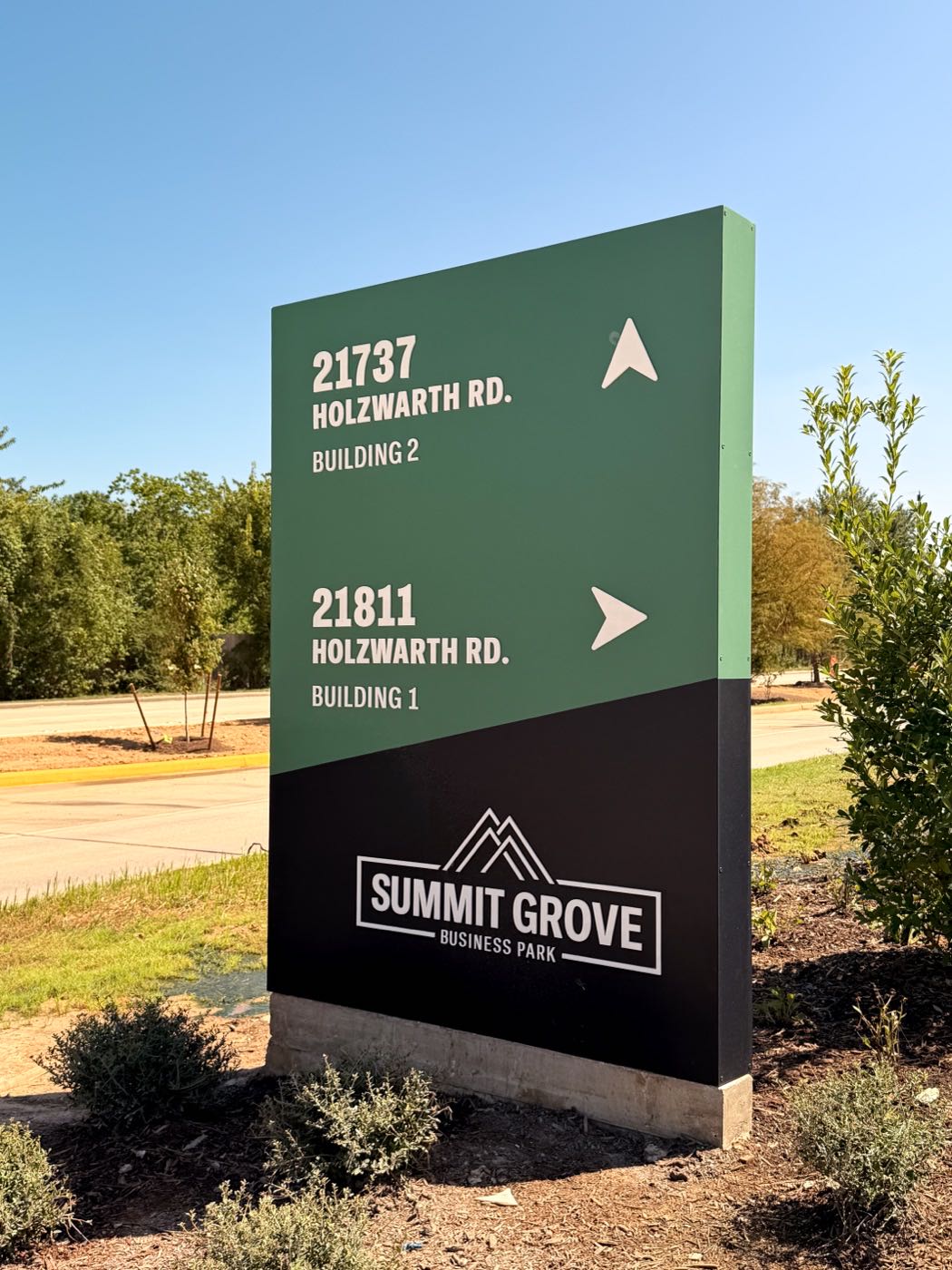 Summit Grove directional sign with building numbers and arrows