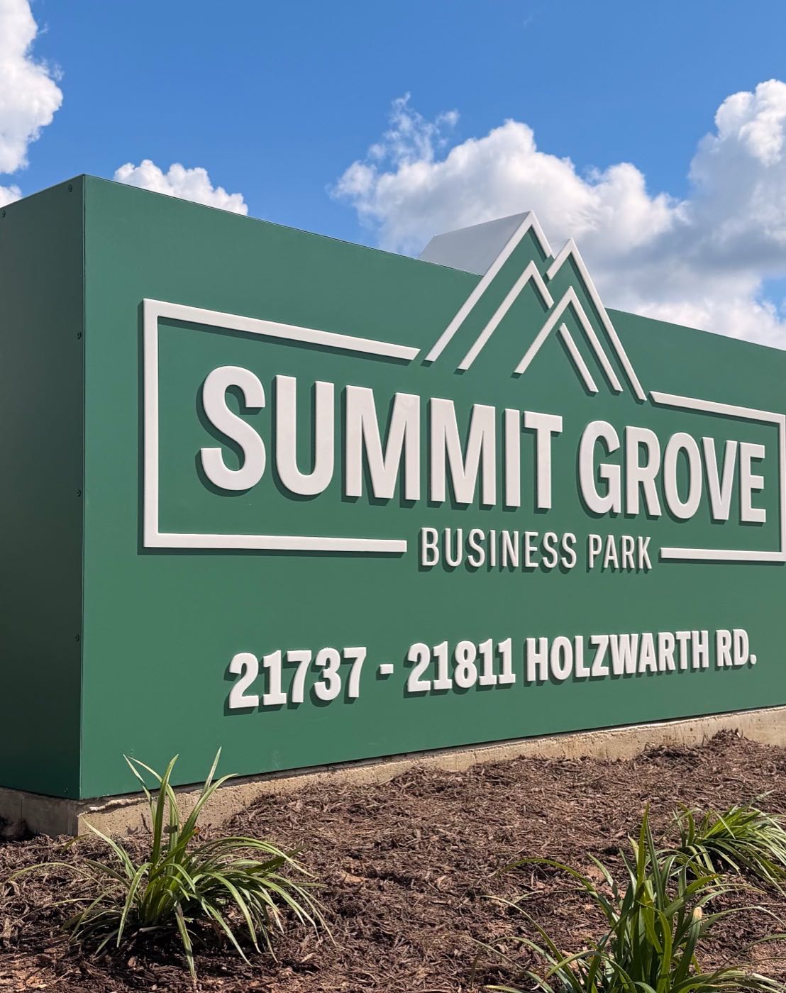 Summit Grove Business Park monument sign made by M3 Graphics: white dimensional letters on a green sign